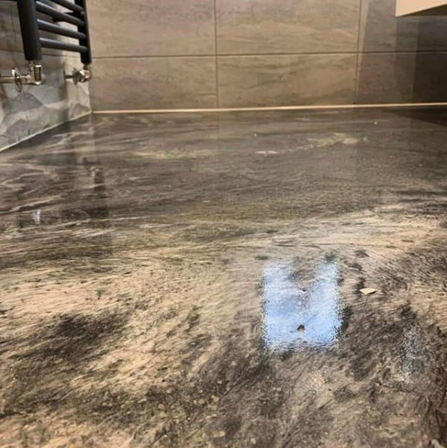 Custom metallic epoxy bathroom floor